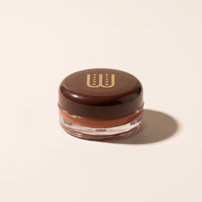 Baume teinté All In One Wuré, packshot sur fond crème