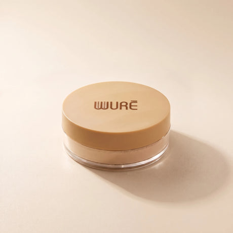 Poudre libre Soft Radiance Wuré, packshot sur fond crème